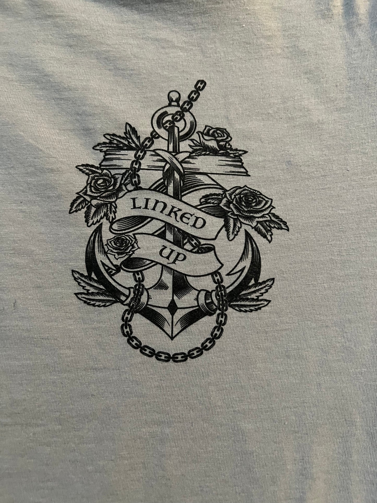 Through the storm anchor black print on cement tshirt